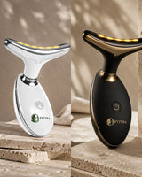 The Fytyra Sculpting Device in White beside the same device in Midnight on travertine