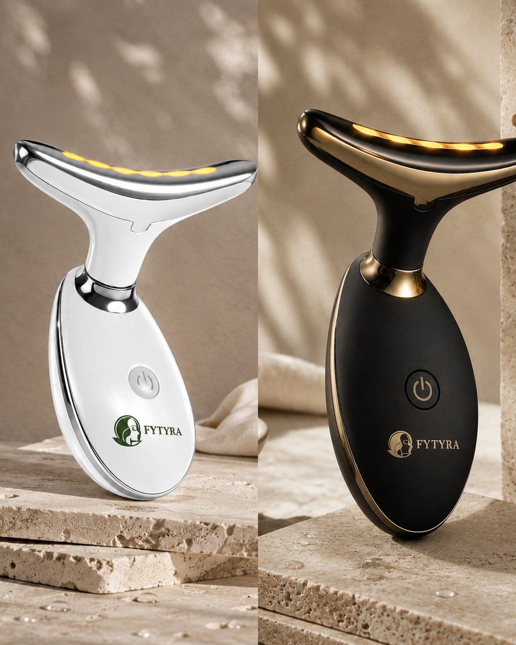 The Fytyra Sculpting Device in White beside the same device in Midnight on travertine