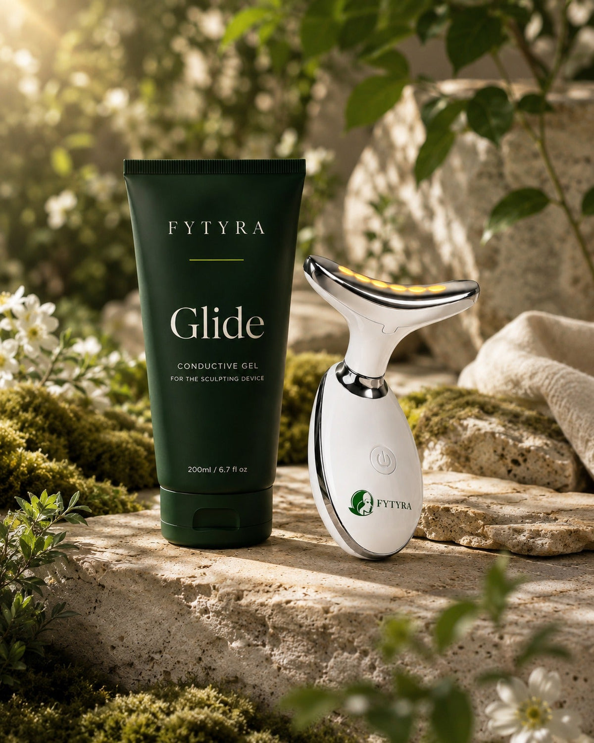 Fytyra Glide beside the Sculpting Device in White on stone in a sunlit garden