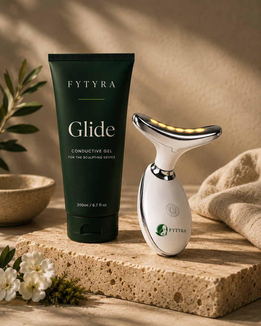 Fytyra Glide beside the Fytyra Sculpting Device on a travertine ledge