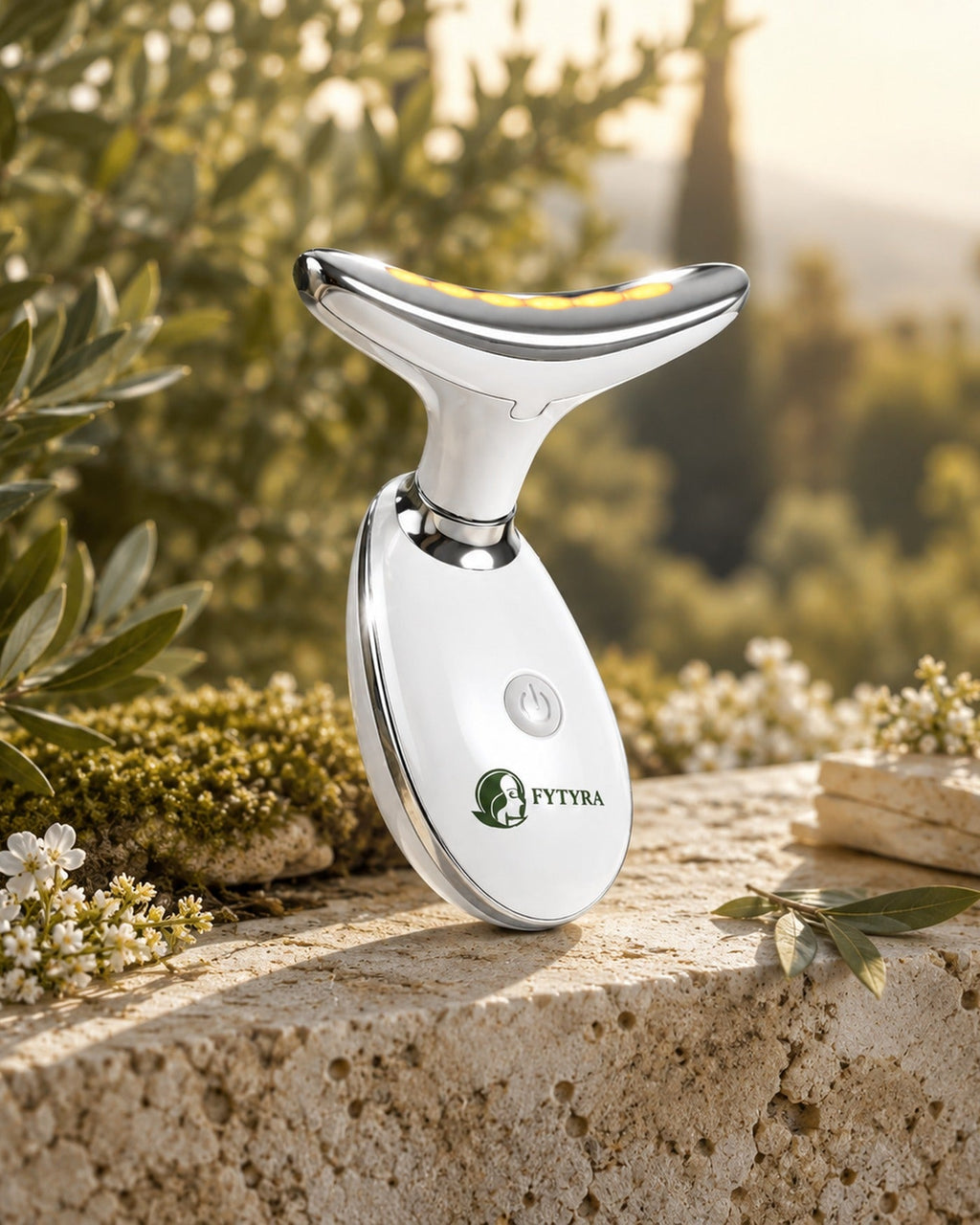 The Fytyra Sculpting Device in White on a stone wall in an olive grove