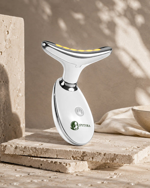 The Fytyra Sculpting Device in White on a travertine ledge in warm daylight
